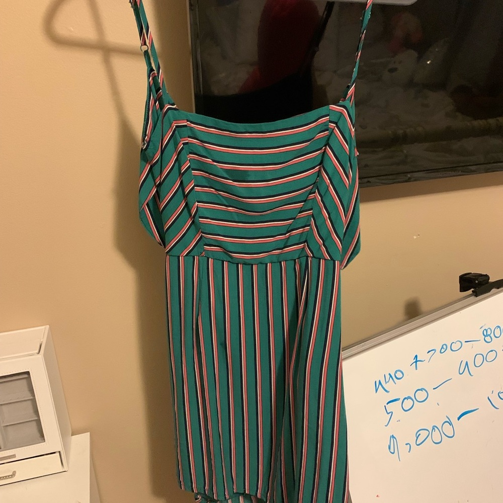 Boutique dress. Worn once. Back ties. Adjustable straps.
